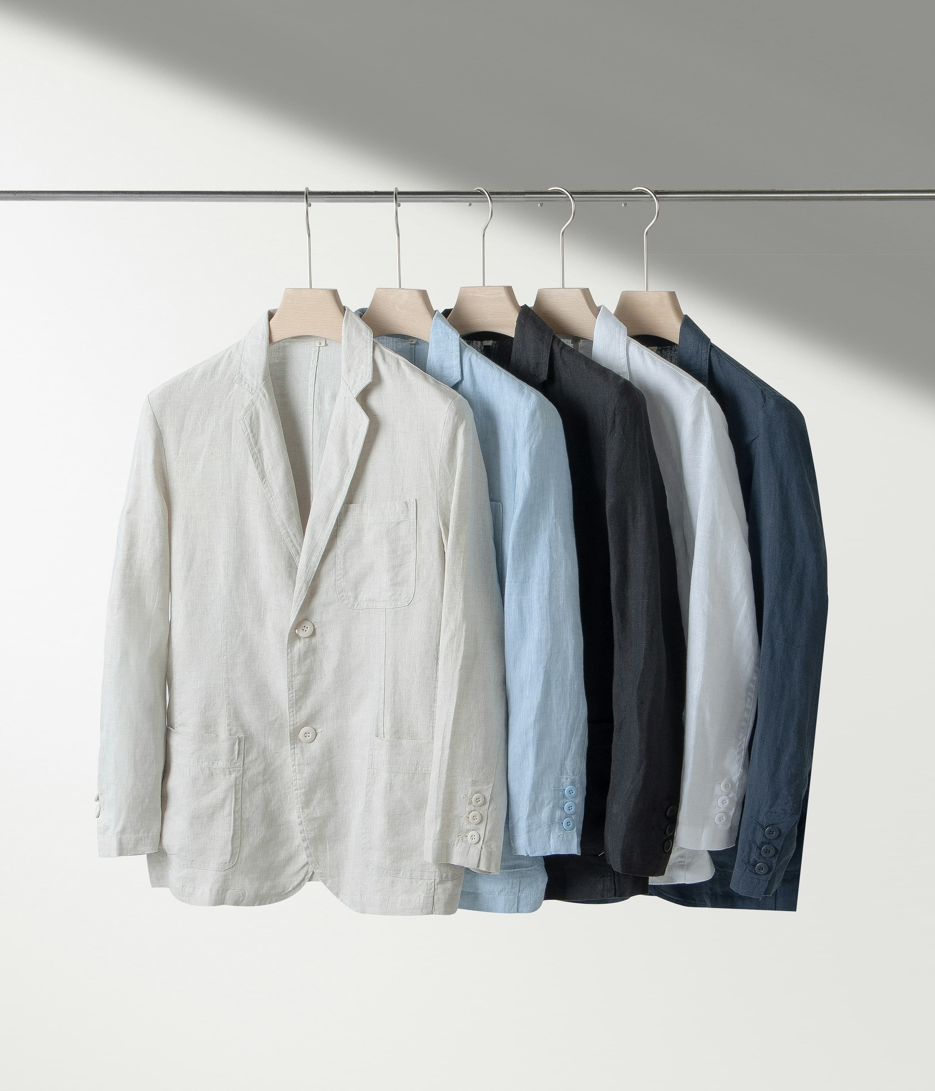 Cleaned jackets and shirts hanging on a rail